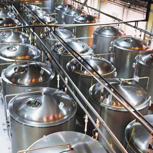 Stainless,Tanks,For,The,Fermentation,Beer.,Shop,Brewery.,Poor,Lighting,